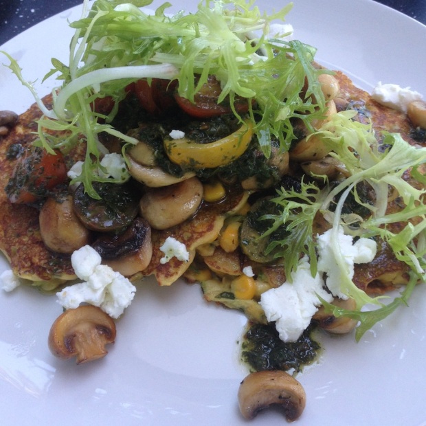Corn fritters with mushrooms and cherry tomatoes